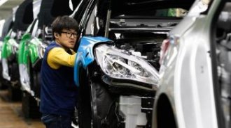 An employee assembles a Hyundai Motor vehicle on the production line at the company’s factory in Asan, South Korea.